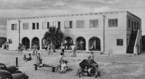 historic photo of the building with people